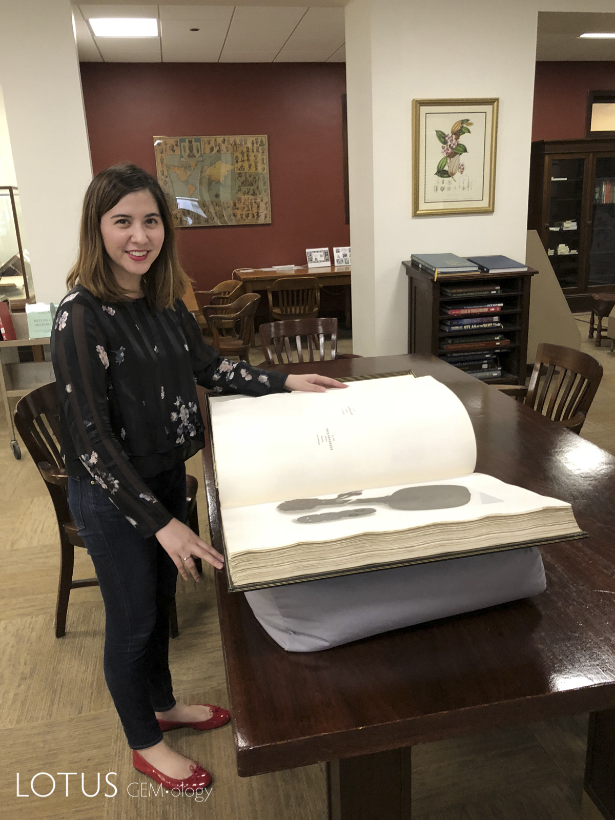 Lotus Gemology’s E. Billie Hughes examining one of the two massive The Bishop Collection: Investigations and Studies in Jade volumes at the library of Chicago’s Field Museum.