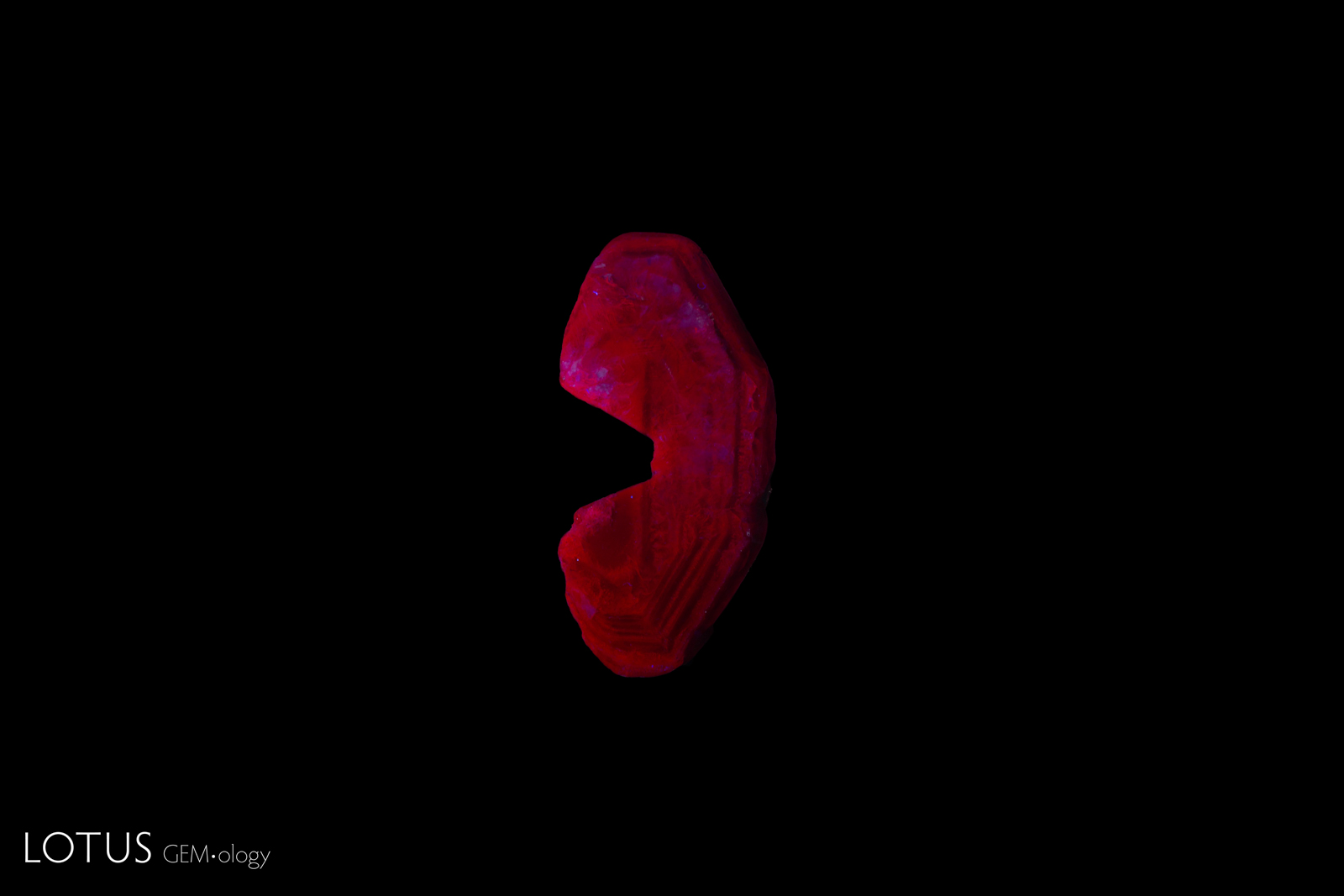Flux synthetic ruby under long-wave UV.