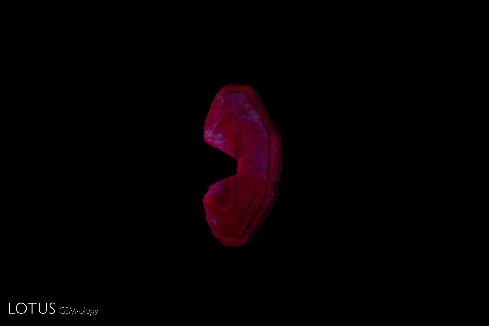 Flux synthetic ruby under short-wave UV.