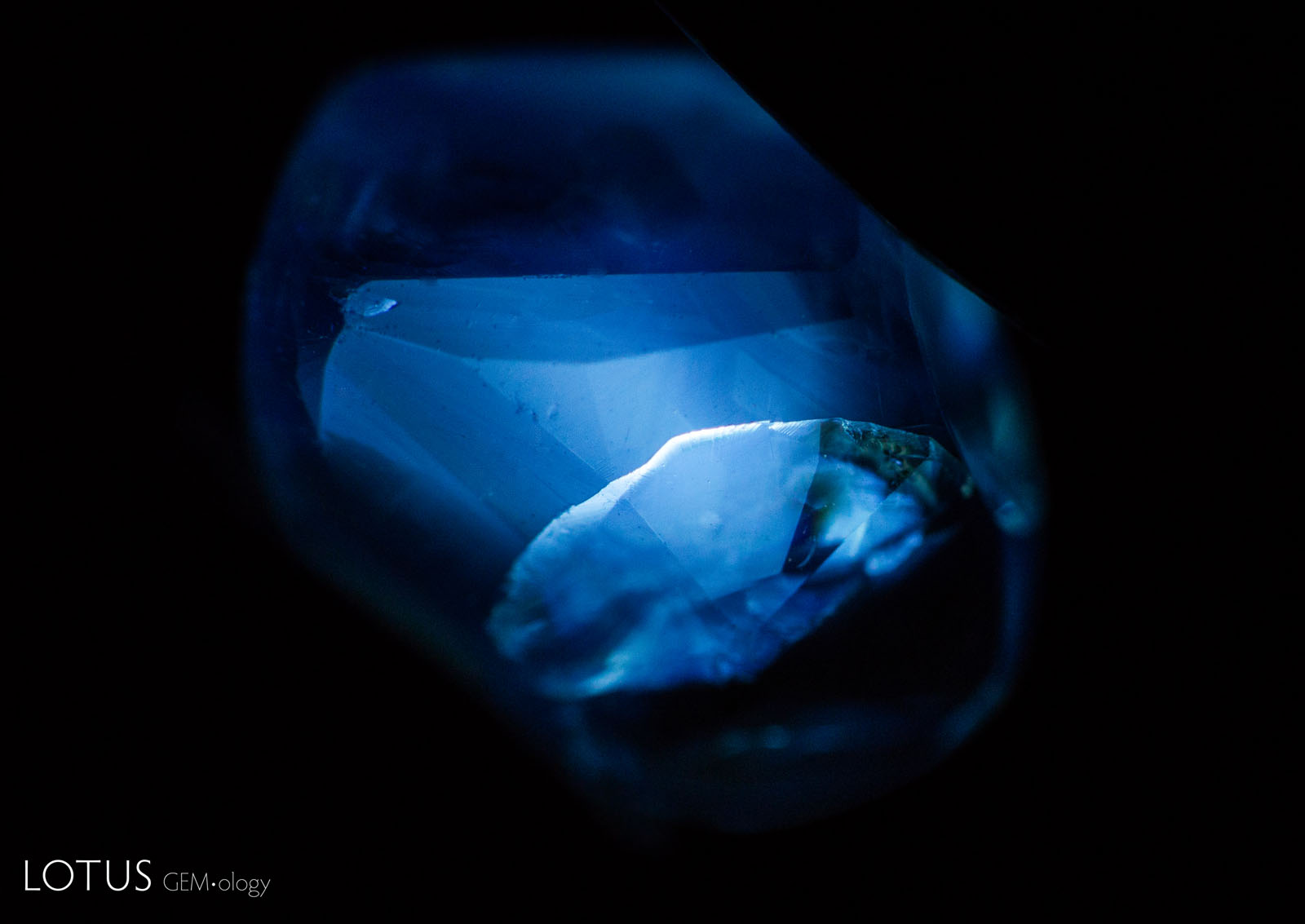 C: By 1300°C the fluorescence reaction was even stronger, with the angular zoned areas barely visible as the stone took on a more chalky appearance overall
