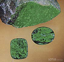 Figure B-3. A "cousin" to jade, maw-sit-sit is an attractive ornamental stone that is an intergrowth mainly of albite, clinochlore, kosmochlor, chromian jadeite, and eckermannitic amphibole. These two maw-sit-sit cabochons weigh 9.87 ct (oval) and 8.48 ct. Courtesy of Pala International; photo © Harold & Erica Van Pelt.