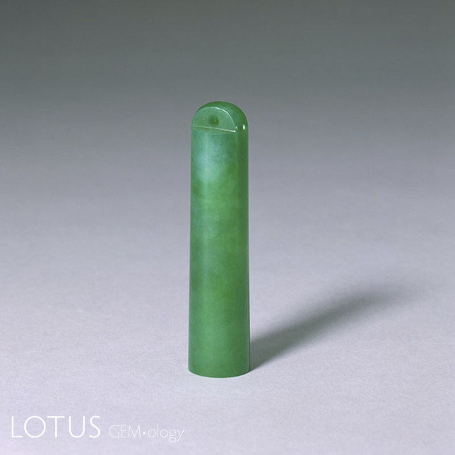 Figure 6. Fei cui feather-tube fastener in the Palace Museum, Beijing; height 7.4 cm, diameter 1.5 cm. Photo: Palace Museum, Beijing.