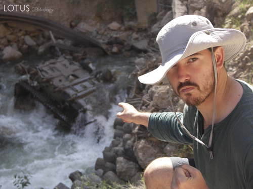 Guillaume "Guji" Soubiraa points out a drowned tank, reminder of the civil war that raged across Tajikistan for several years following independence from the Soviet Union. Photo: Vincent Pardieu