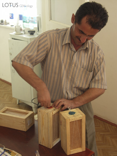 Boxes of rough ruby from the Snezhny mines are unsealed at the Gubjemast office in Dushanbe. Photo &copy; Vincent Pardieu