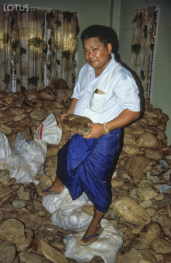 A room with a view U Tin Ngwe, who went from taxi driver to jade kingpin almost overnight, stands atop a small fortune of jade at his Hpakan home