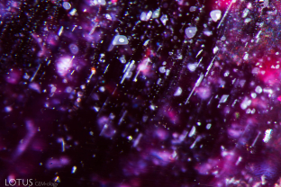 When a Mozambique ruby is heated, the silk may start to break down, resulting if mottling or bubbles appearing in the daughter minerals, as seen here.