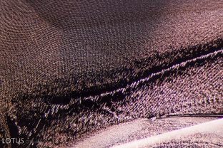 A moire fingerprint forms a fine pattern in this untreated sapphire from Sri Lanka.