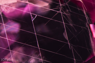 Rose channels (formerly thought to be boehmite needles) forming Star of David pattern in a flux healed Greenland pink sapphire.