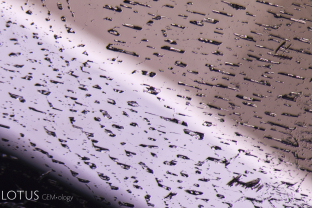 This healed fissure in a cobalt-bearing color-change spinel shows tiny negative crystals in the plane of the former fissure.