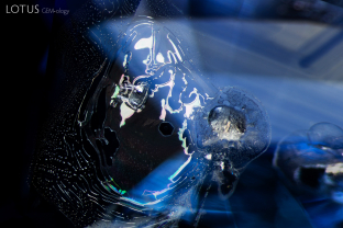 The frosted surface of this large crystal and drippy, melted appearance of the associated fingerprint provide evidence that this sapphire has undergone heat treatment.