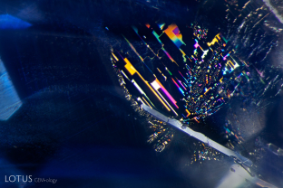 A negative crystal, surrounded by iridescent fingerprints, creates a stunning inclusion scene in this Sri Lankan sapphire. Specimen courtesy Asia Lounges.