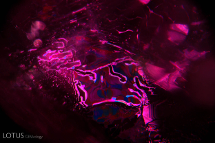 This fingerprint in a heat-treated ruby from the Thai/Cambodian border displays the underlying atomic symmetry by the pattern of healing. The healed areas are hexagonal in shape, showing that the fingerprint lies in the basal plane.