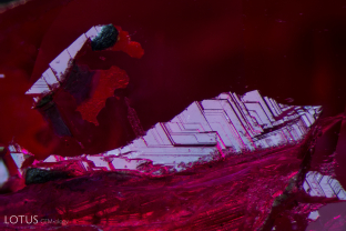 A natural on the surface of a cut Ramaura flux ruby.